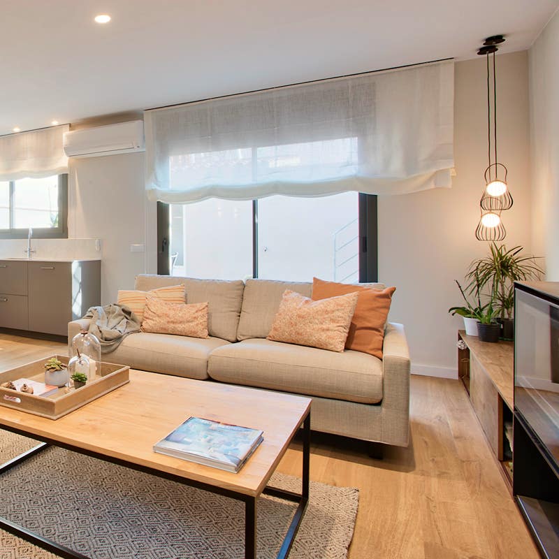 Xavi Moya Fotografía Inmobiliaria en Barcelona de un salón comedor acogedor